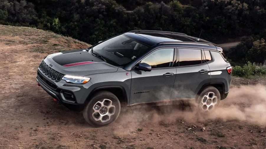 The 2024 Jeep Compass Trailhawk off-roading in the dirt
