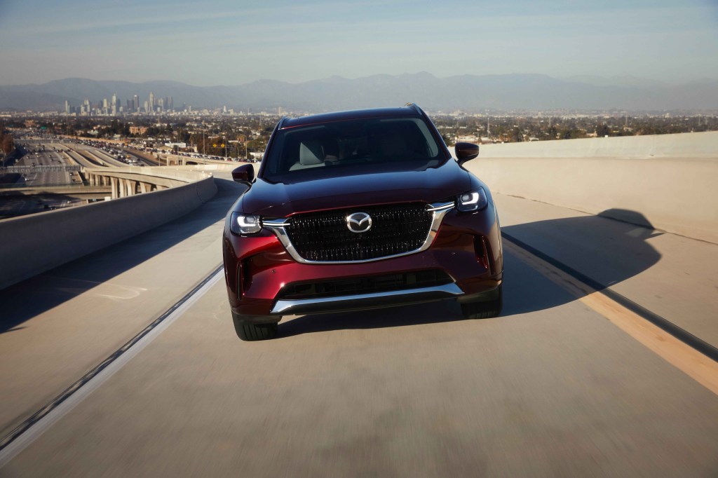2024 Mazda CX-90 driving along a highway