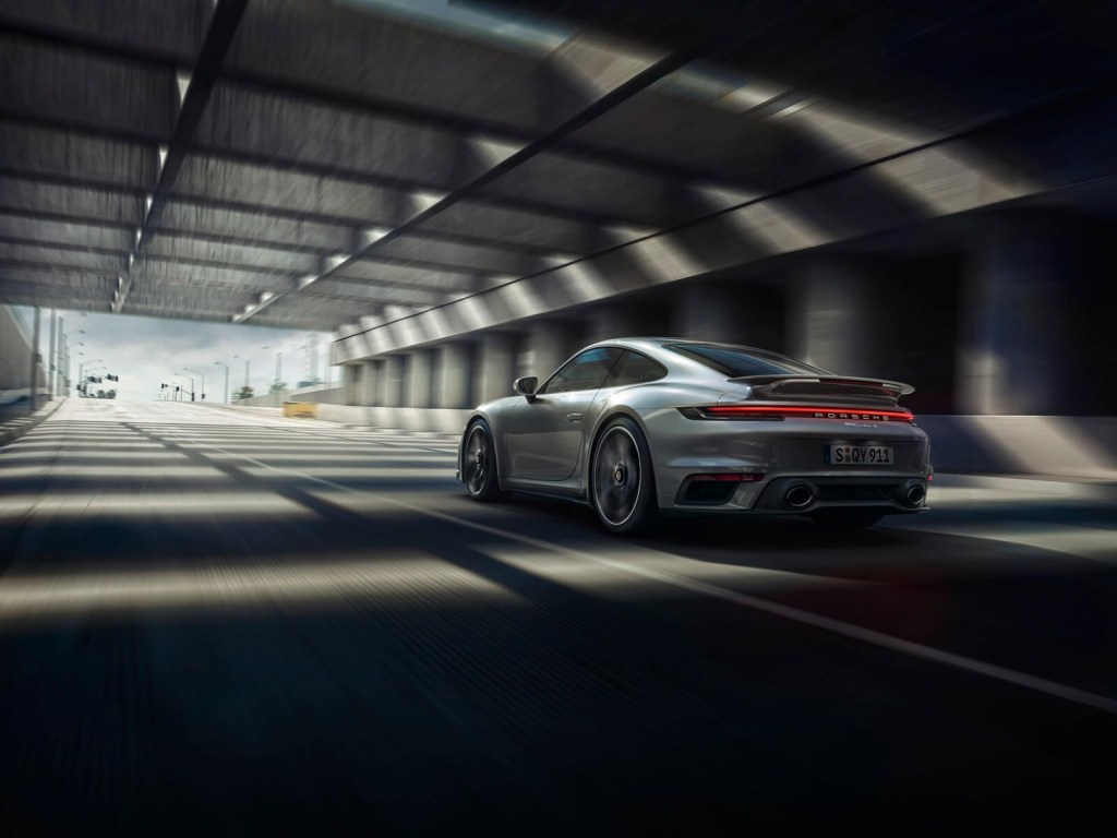 A 2024 Porsche 911 Turbo S drives through a tunnel. 