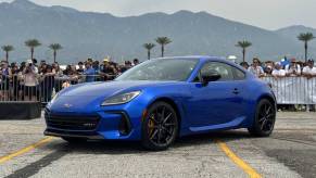Blue 2024 Subaru BRZ tS Shown off in front of a crowd