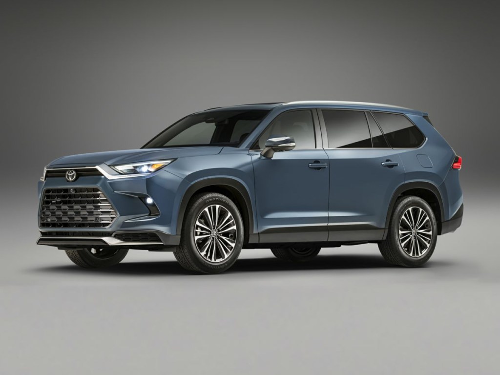 The 2024 Toyota Grand Highlander on display with a grey backgorund