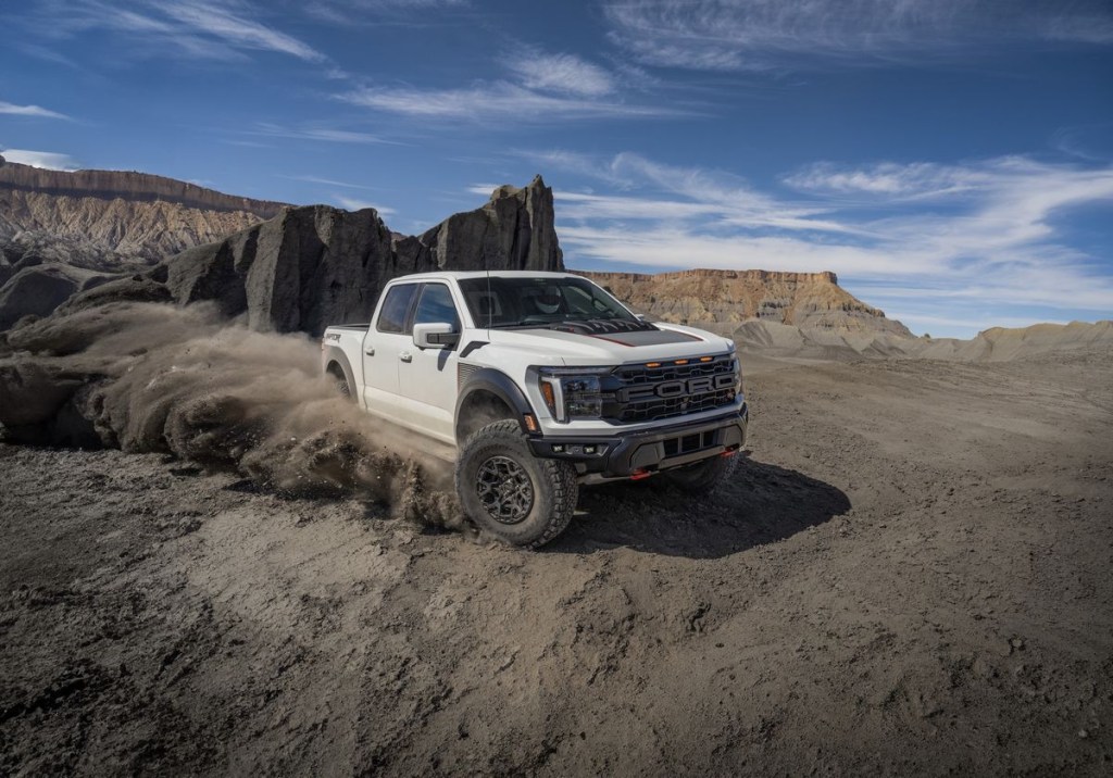 The 2024 Ford F-150 Raptor R kicking up sand