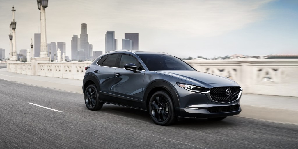 The 2024 Mazda CX-30 driving down the road
