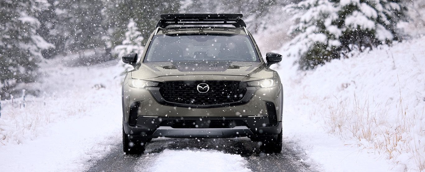 The 2024 Mazda CX-50 traversing through the snow