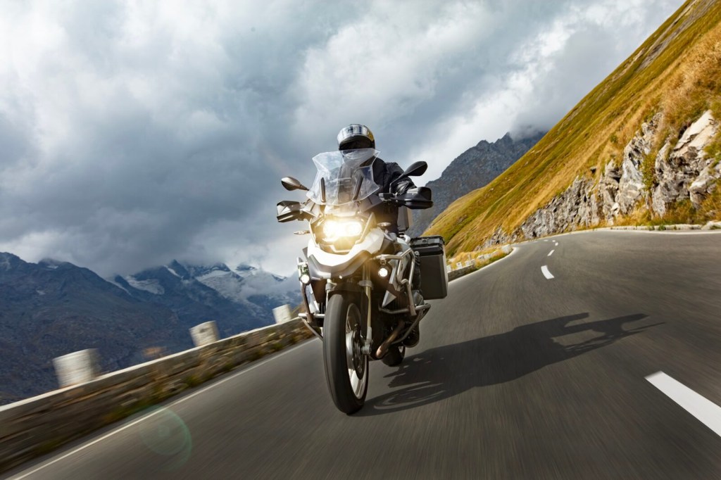 A rider takes to the highway on an adventure motorcycle as a commuter. 