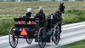 An Amish family in a horse-drawn buggy