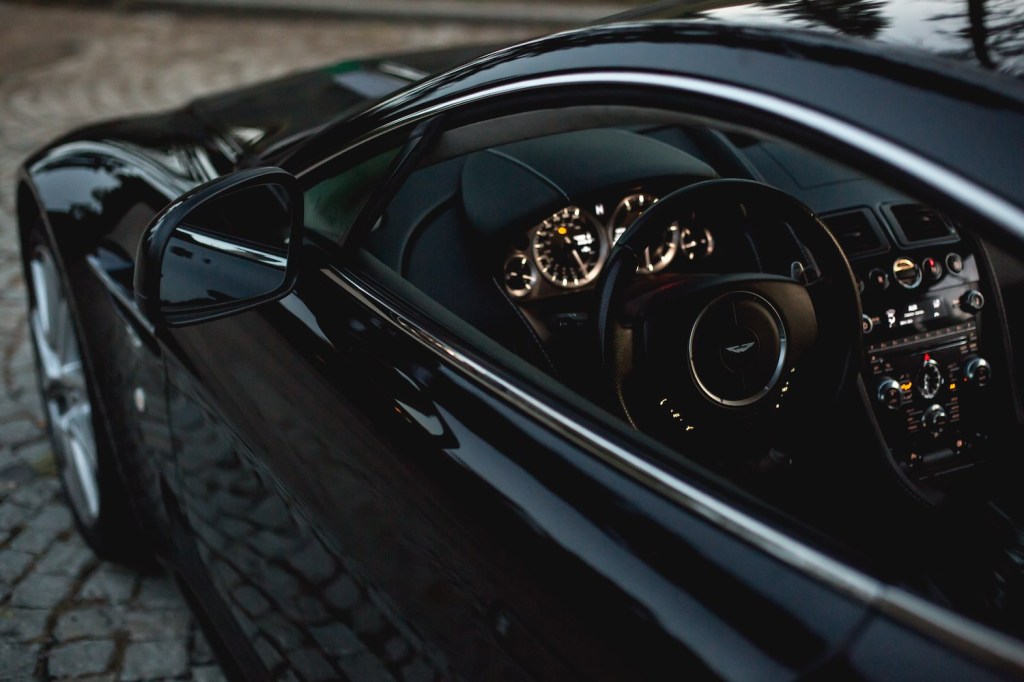 The door and dashboard of an Aston Martin sports car you could unlock with a Jaeger-LeCoultre watch