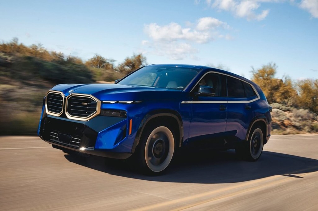 A 2023 BMW XM cruises down a desert road.
