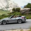 A gray BMW Z4 drives on a mountain road.