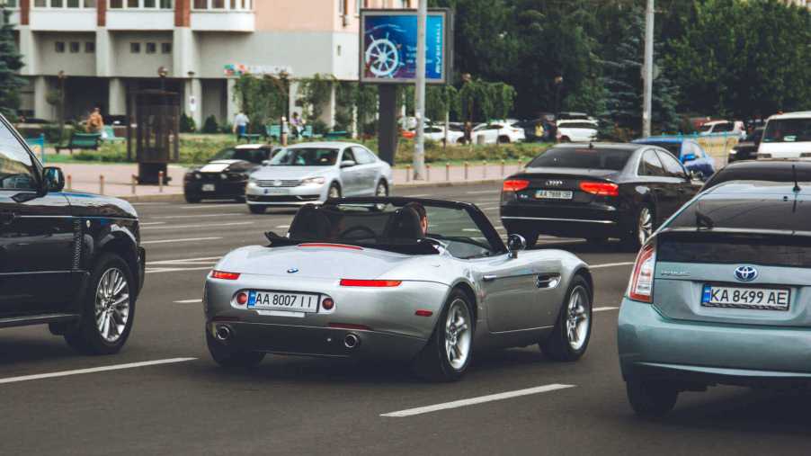 A BMW Z4 like Matthew Perry's drives on a crowded street.