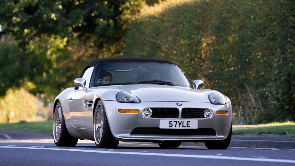 A silver BMW Z8 like the one in Matthew Perry's collection drives with its top down.