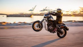 A Buell Super Cruiser performs a wheelie.