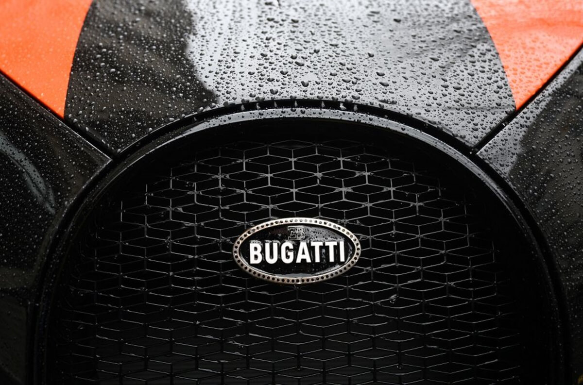 One of Drake's choices for a celebrity car, a Bugatti hypercar flashes its badge.