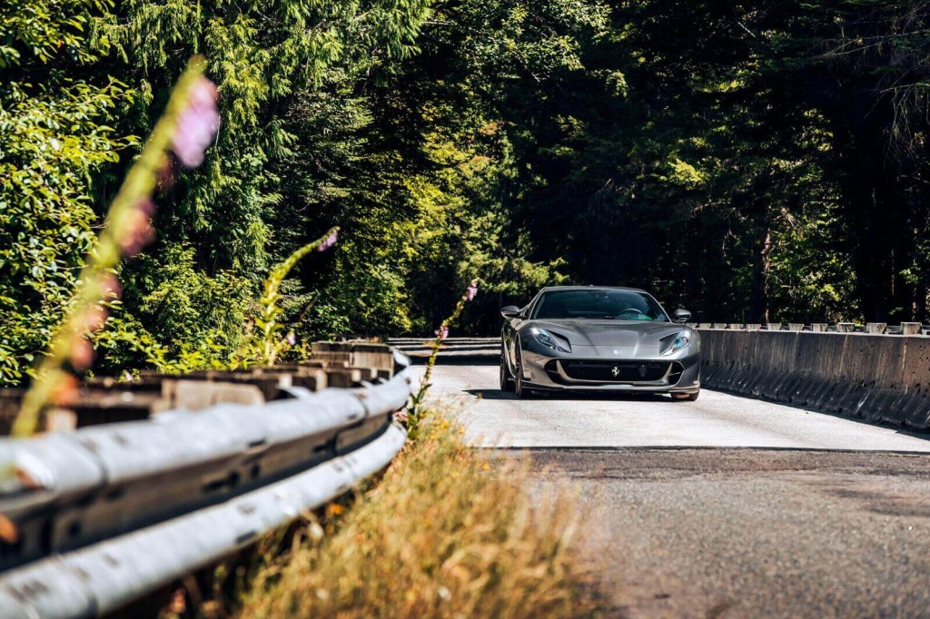A gray Ferrari 812 Superfast, like Michael B. Jordan's, takes a corner.