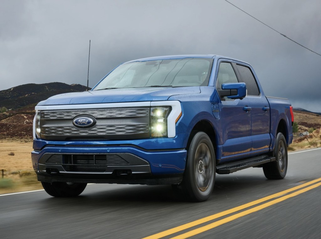 The 2023 Ford F-150 Lightning driving on the road