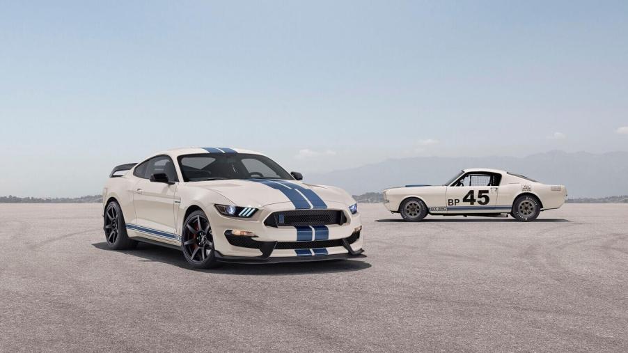 A Ford Mustang Shelby GT350 sits next to a classic GT 350.
