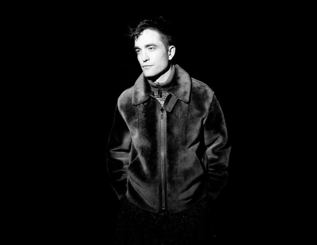 Robert Pattinson, one of the celebrities behind 'Twilight,' poses for a black and white photo. 