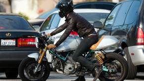A-list celebrity motorcycle rider Ryan Reynolds straddles his Paul Smart Ducati in LA.