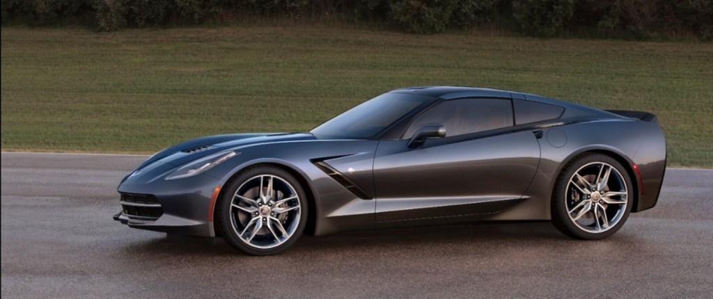 A gray C7 Chevrolet Corvette, one of the cars with the worst depreciation, shows off its side profile. 