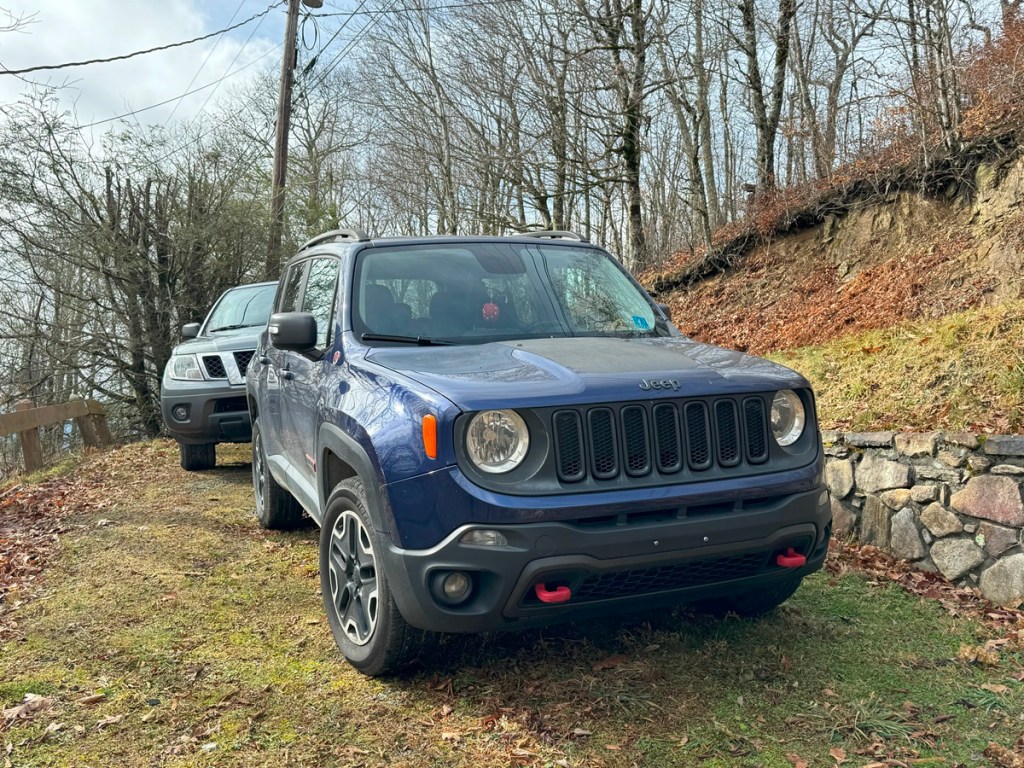 Allison Barfield's personal Jeep Renegade trailhawk parked on a 4x4 dirt road, in front of a pickup.