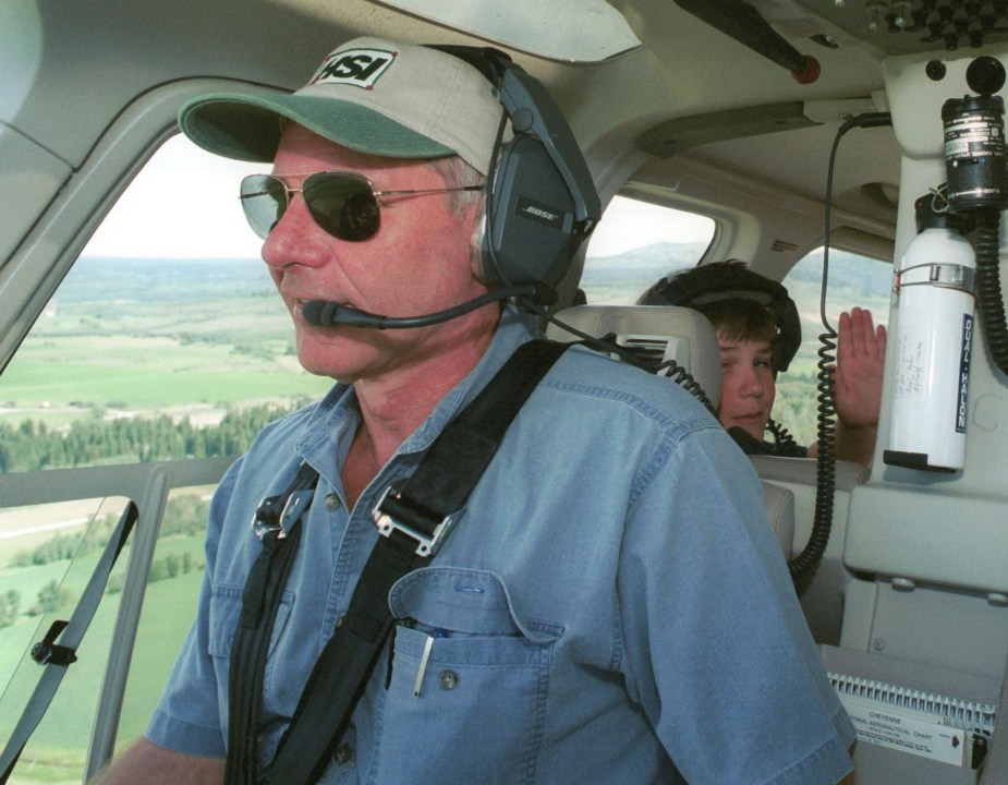 Harrison Ford rescues boy scout Cody Clawson in his helicopter.