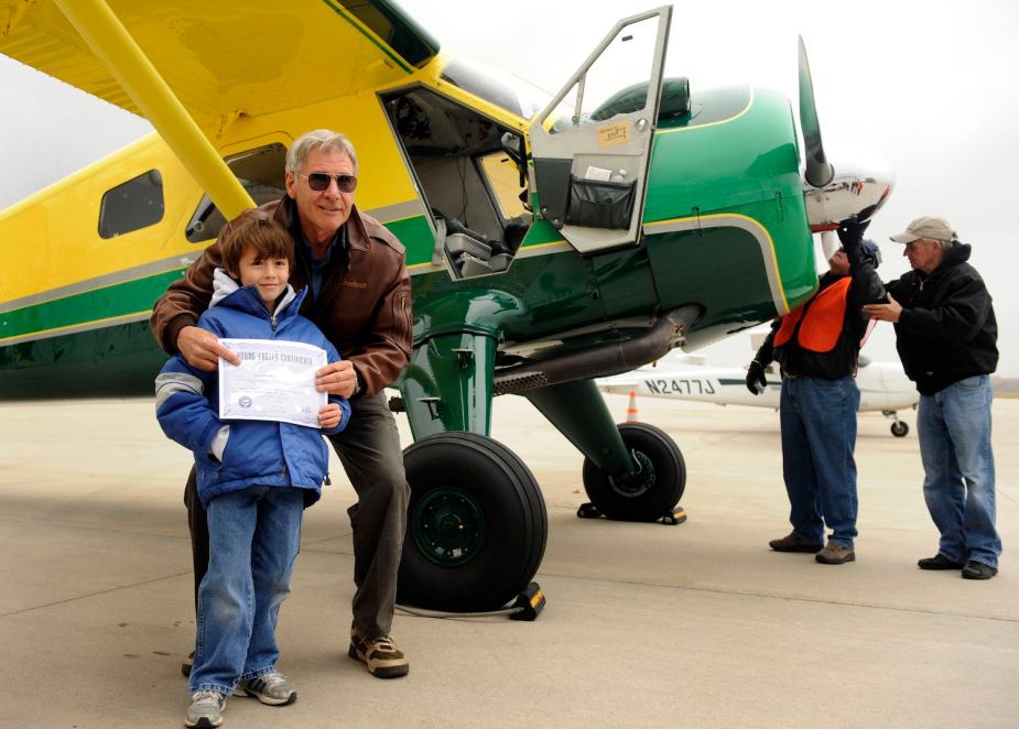Harrison Ford gives children airplane rides in Denver, Colorado.