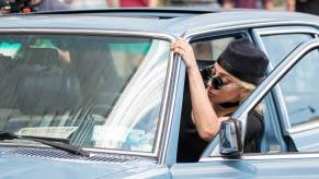 Lady Gaga gets into her W123 Mercedes.