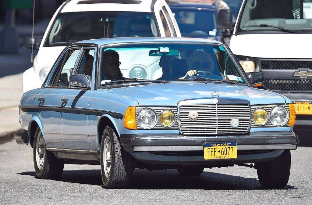 Lady Gaga with her W123 Mercedes on city streets.