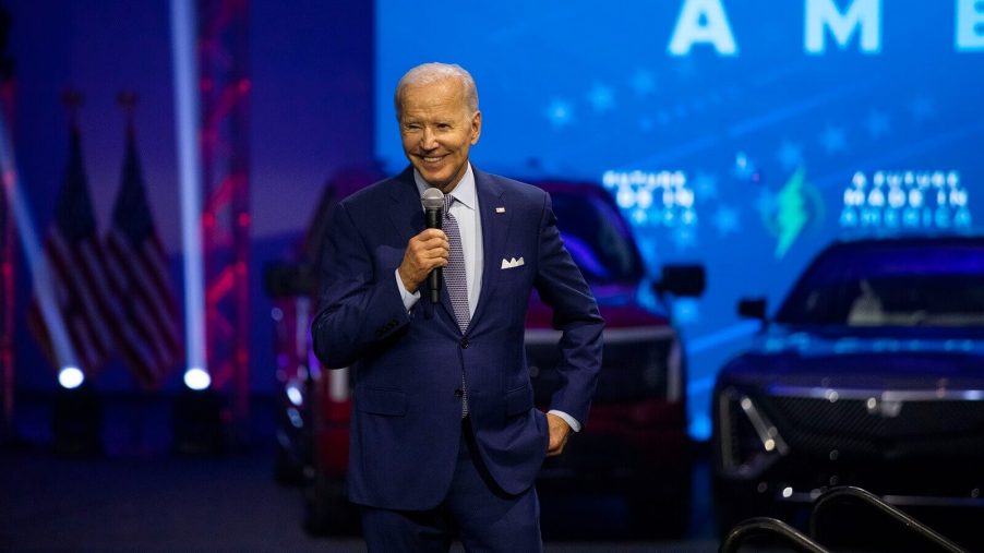 Joe Biden speaks at a the North American International Auto Show amid Chevrolet Corvettes and new cars.