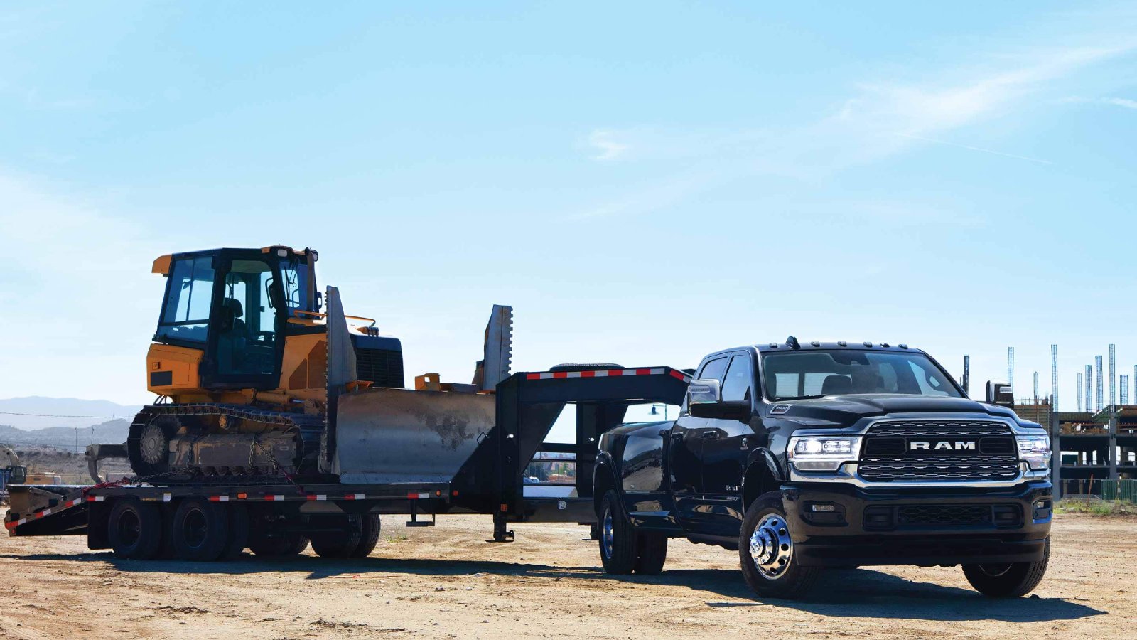 Cummins Diesel-Powred Ram 3500 HD Truck towing Construction Equipment
