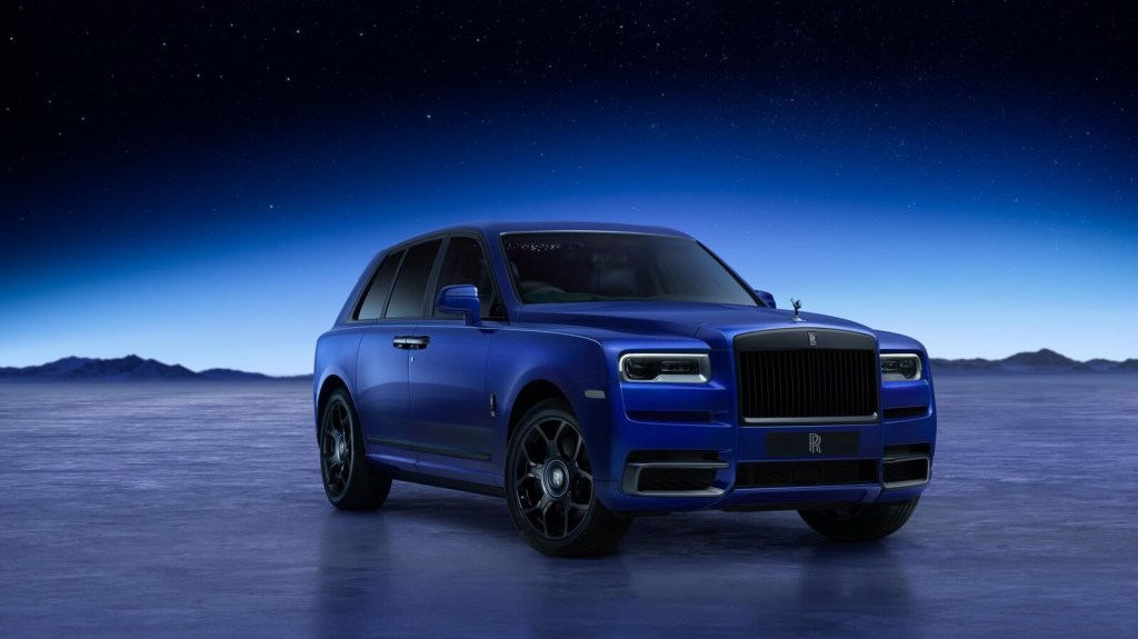 A blue Rolls-Royce Cullinan shows off its front-end styling. 