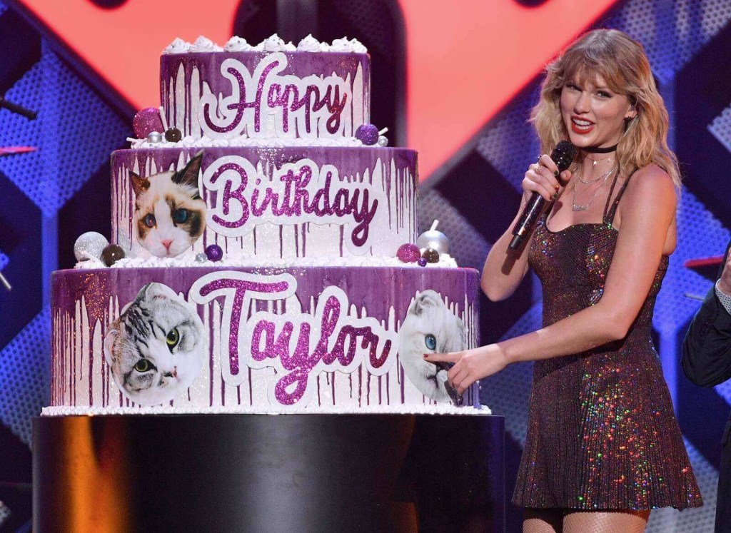 Taylor Swift smiles at a birthday celebration.