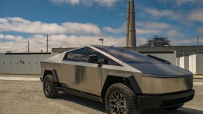 The Tesla Cybertruck parked near a factory