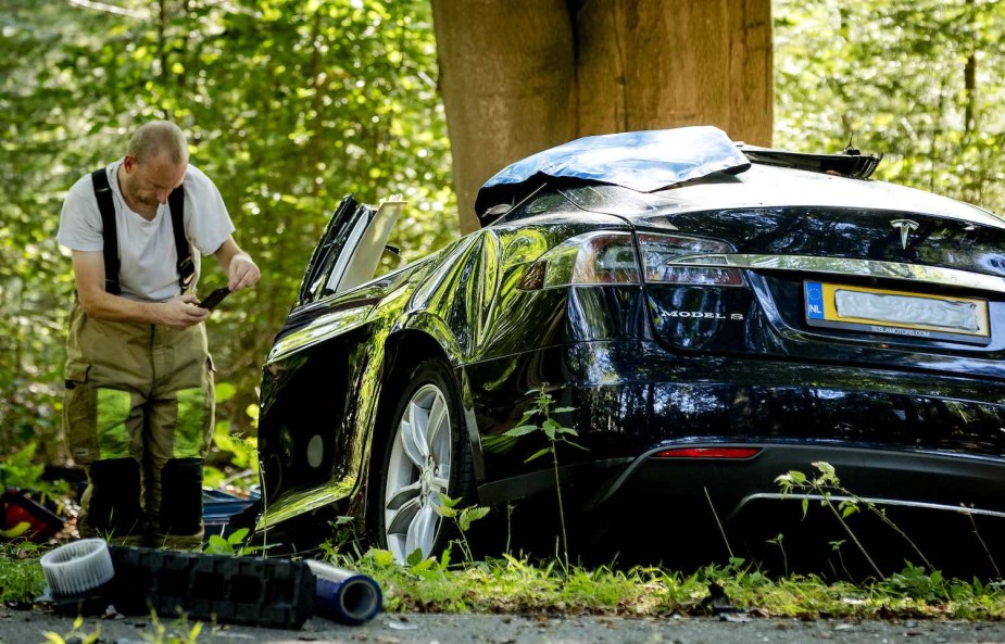 Tesla sedan equipped with autopilot crashed in the woods.