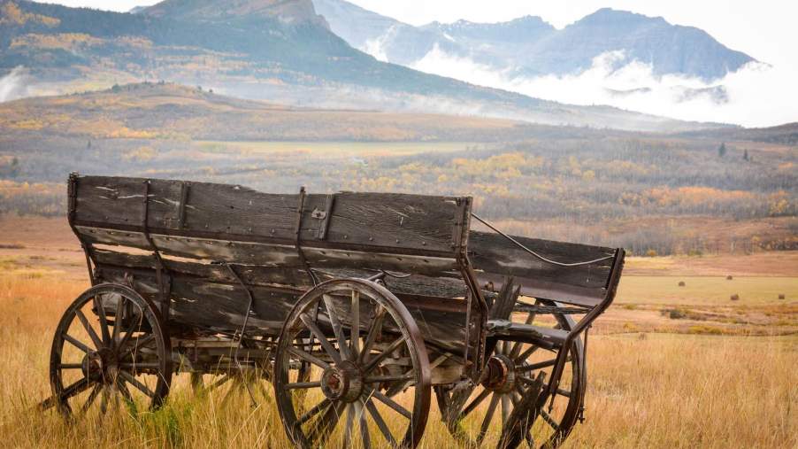 A wagon sitting in a field beneath the Cumberland Gap,