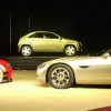The DaimlerChrysler concept line unveiling, including a green Jeep Varsity, at the 2000 Detroit Auto Show.