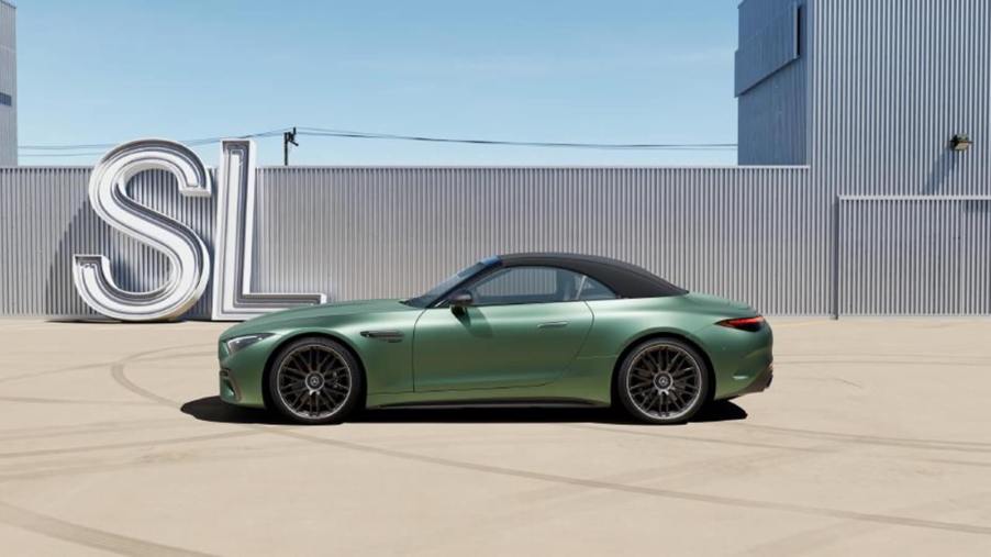 A green 2024 Mercedes-AMG SL 63 S E Performance shows off its side profile.