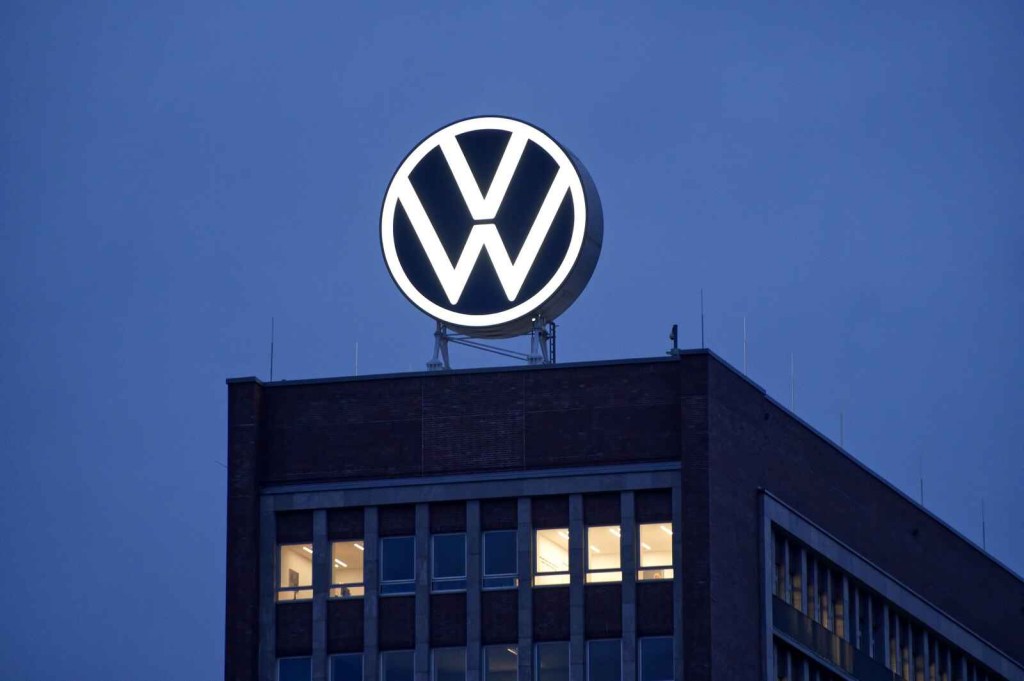 VW logo sign sits atop the square VW AG headquarters building in Wolfsburg Germany