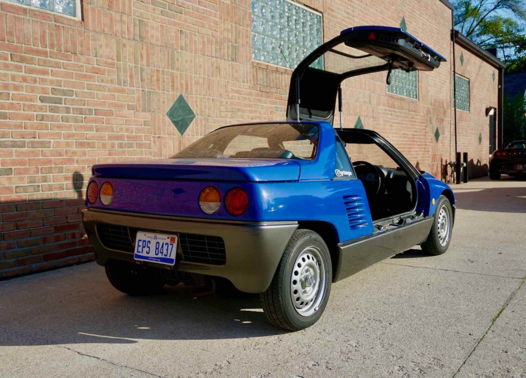 Autozam AZ-1 with its gull-wing door open.