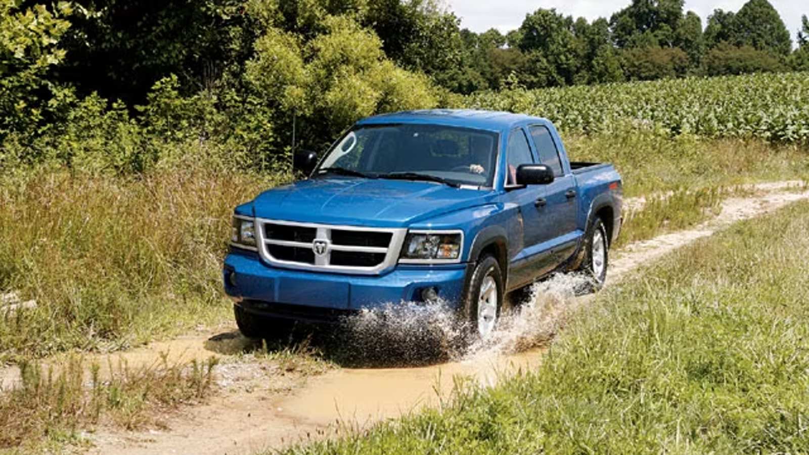 Blue 2008 Dodge Dakota TRX4 playing on an off-road trail. This was one of the original TRX trucks.
