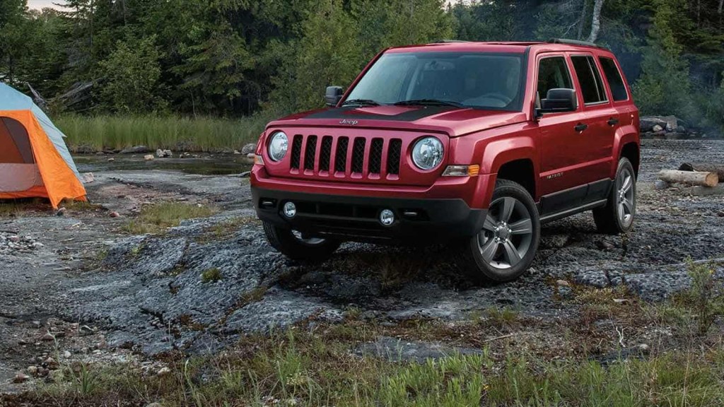 2016 Jeep Patriot posed at a campground. A version of this dead car model was sold in 2023.