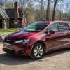 Red 2018 Chrysler Pacifica Hybrid Parked in front of a home.