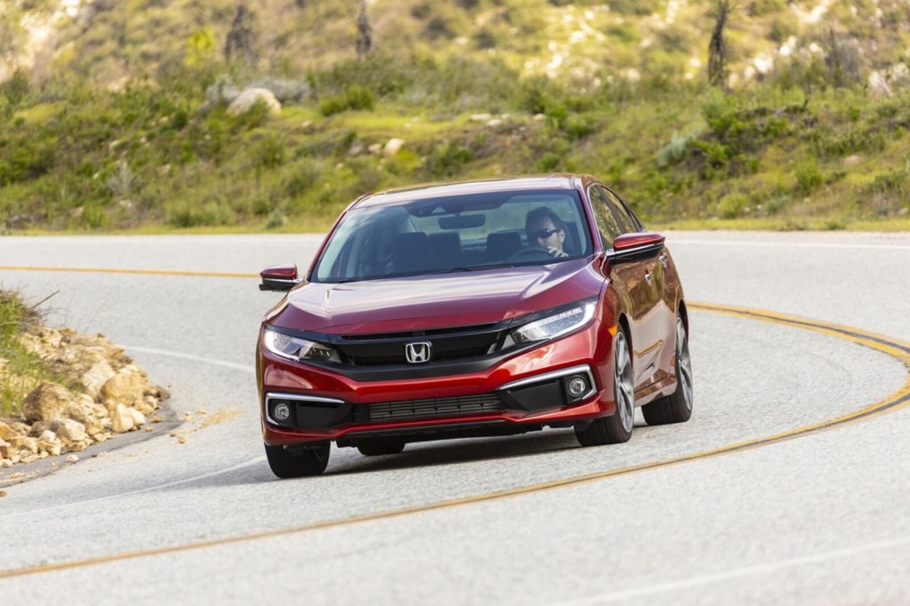 A 2019 Honda Civic, a less-popular passenger car than the Toyota Camry, takes a corner. 