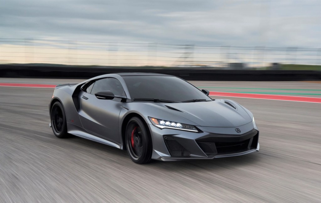 A gray 2022 Acura NSX Type S flies across a track.