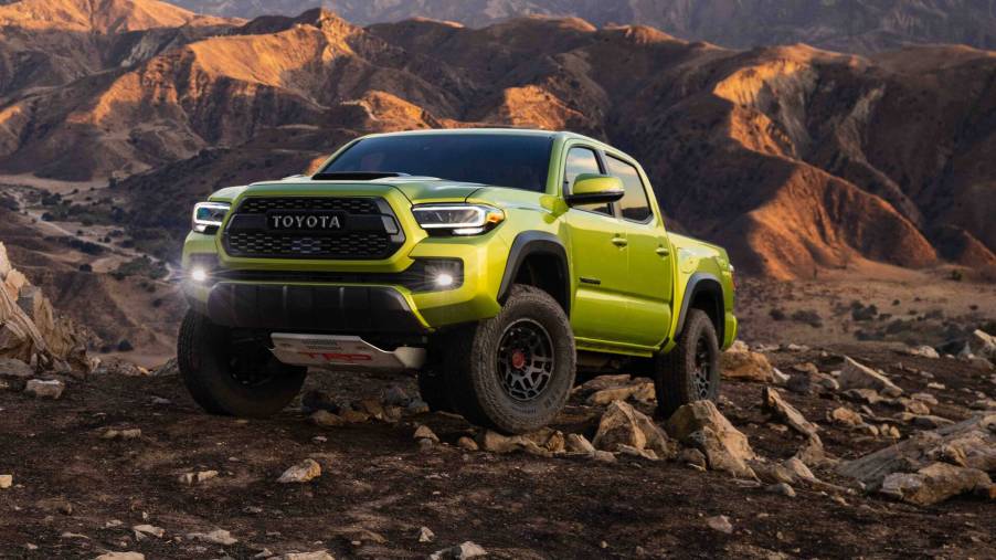 The 2023 Toyota Tacoma climbing over rocks