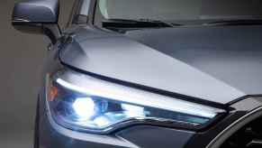 A close right front view of a silvery blue 2023 Toyota Corolla Cross