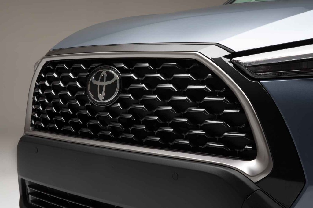 The grille and Toyota emblem of a 2023 Toyota Corolla Cross