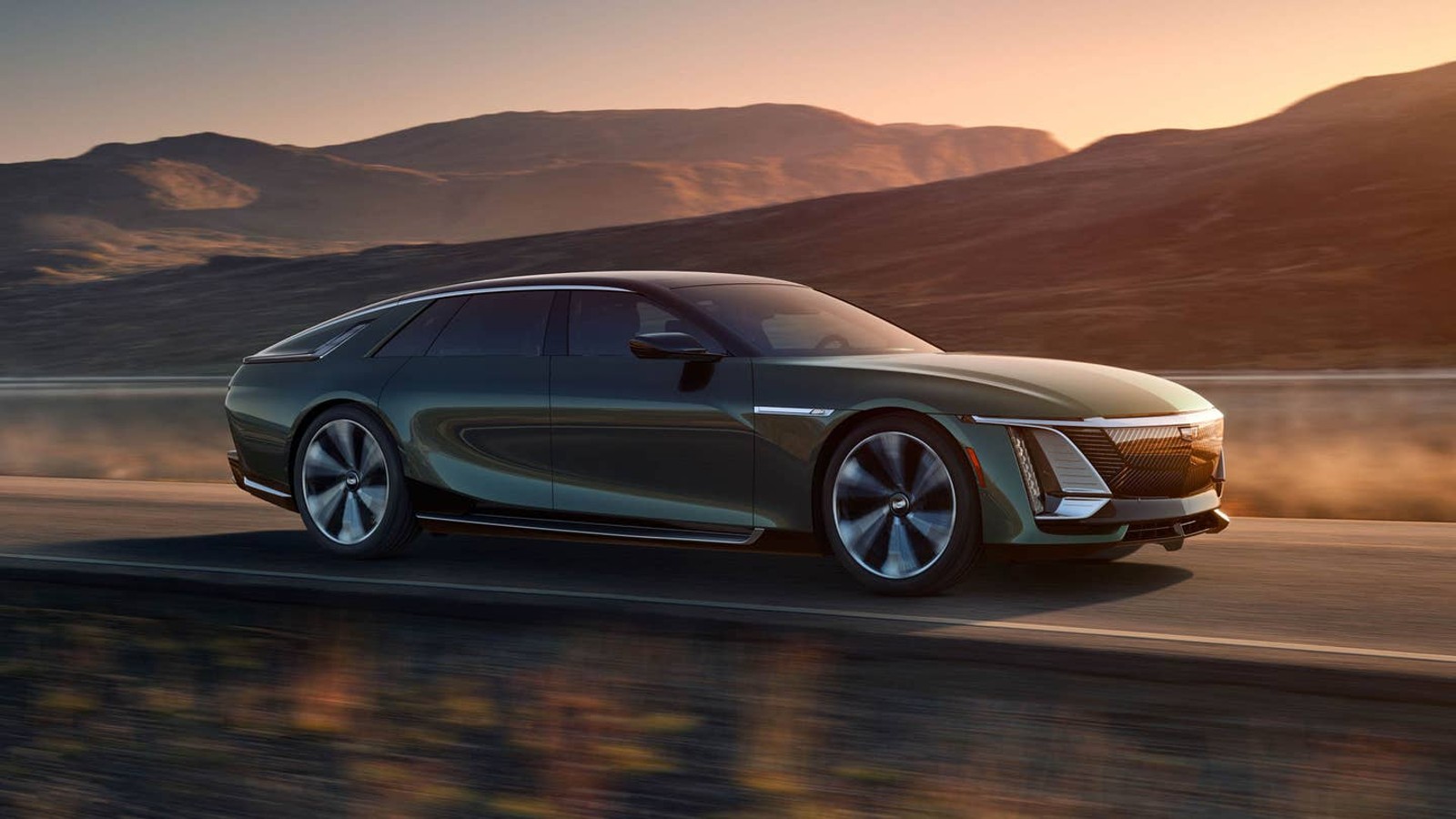 Green 2024 Cadillac Celestiq driving on a road during a sunset.
