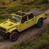 The 2024 Jeep Gladiator off-roading in mud