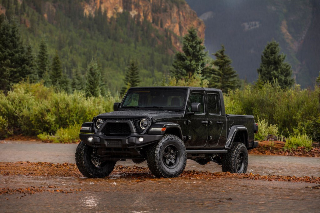 The 2024 Jeep Gladiator parked by a lake